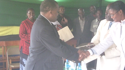 MUET receiving a certificate of appreciation for environmental care from Mufindi District Council
